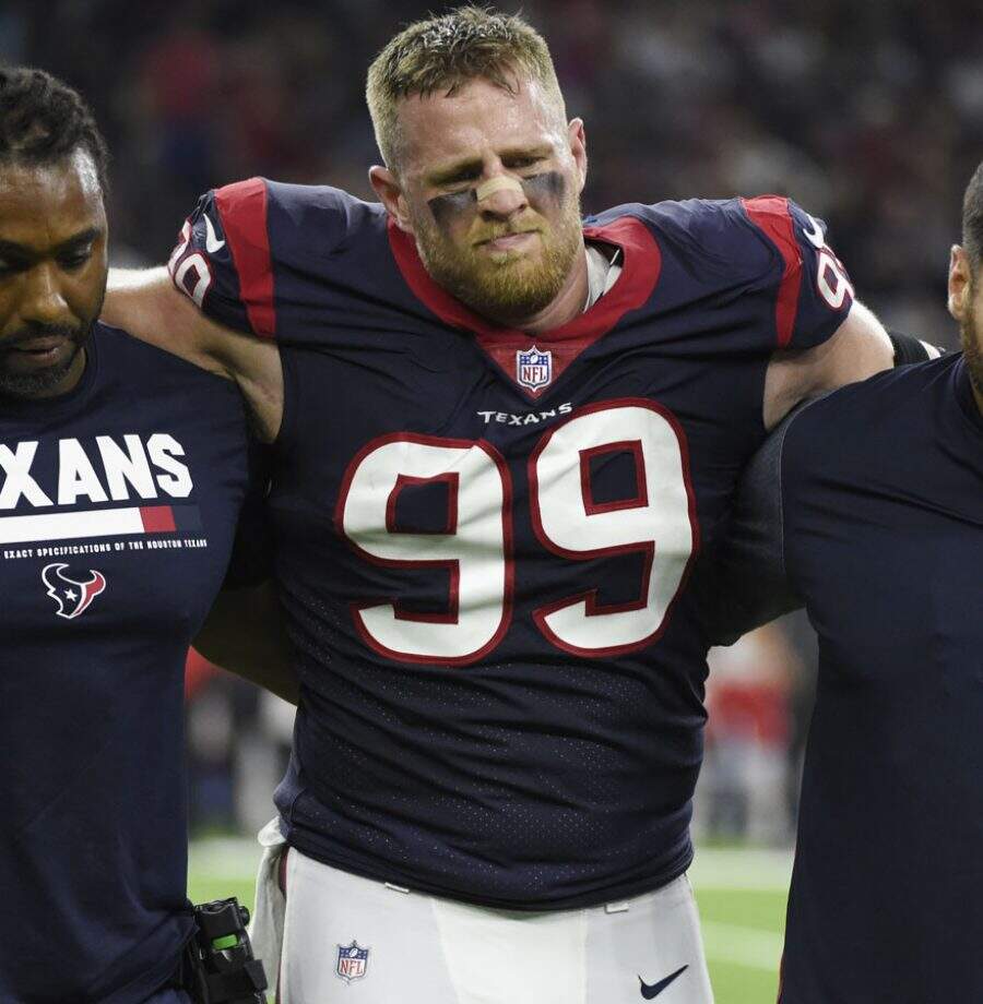 Houston Texans defensive end J.J. Watt (99) is helped off the field after an injury during the first half of an NFL football game Sunday, Oct. 8, 2017, in Houston. (AP Photo/Eric Christian Smith)