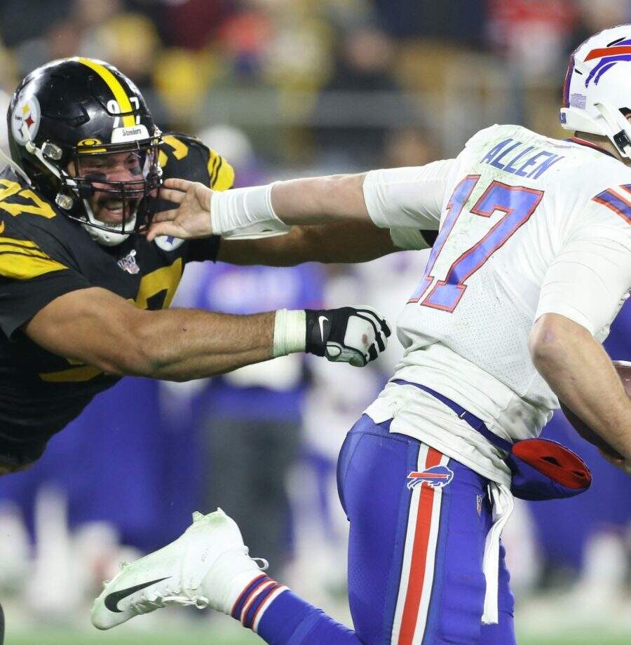 Dec 15, 2019; Pittsburgh, PA, USA;   Buffalo Bills quarterback Josh Allen (17) runs the ball against Pittsburgh Steelers defensive end Cameron Heyward (97) during the third quarter at Heinz Field. Mandatory Credit: Charles LeClaire-USA TODAY Sports