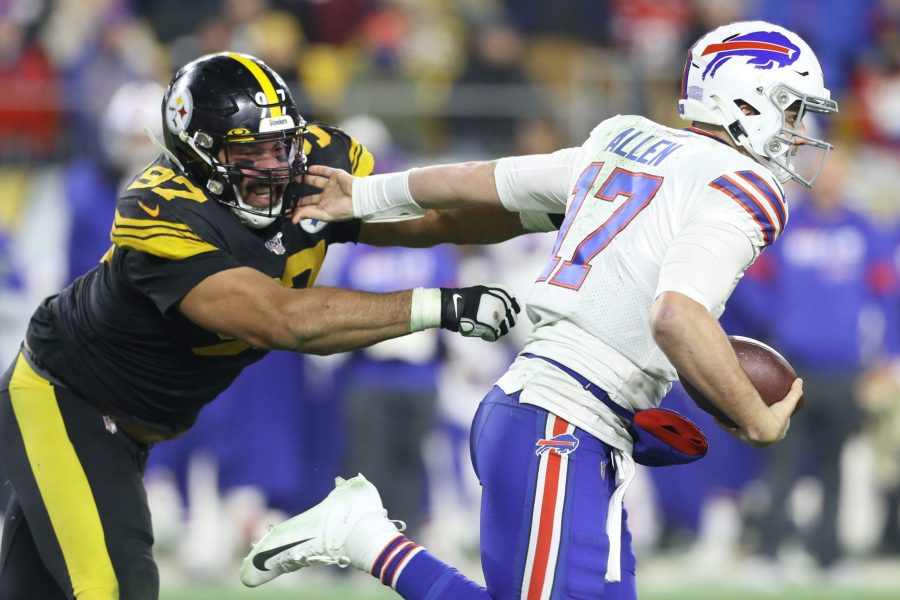 Dec 15, 2019; Pittsburgh, PA, USA;   Buffalo Bills quarterback Josh Allen (17) runs the ball against Pittsburgh Steelers defensive end Cameron Heyward (97) during the third quarter at Heinz Field. Mandatory Credit: Charles LeClaire-USA TODAY Sports
