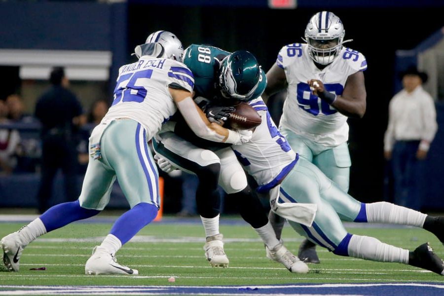 Dallas Cowboys' Leighton Vander Esch (55) and Jaylon Smith, right, tackle Philadelphia Eagles' Dallas Goedert (88) who fumbles the ball in the first half of an NFL football game in Arlington, Texas, Oct. 20, 2019. The Cowboys recovered the fumble. (AP Photo/Michael Ainsworth)