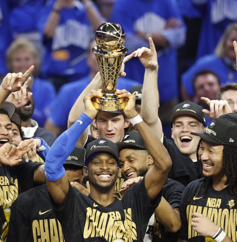 INDIANAPOLIS, IN - JUNE 22: Shai Gilgeous-Alexander #2 of the Oklahoma City Thunder celebrates winning the Bill Russell NBA Finals Most Valuable Player trophy after winning Game Seven of the 2025 NBA Finals against the Indiana Pacers on June 22, 2025 at Gainbridge Fieldhouse in Indianapolis, Indiana. NOTE TO USER: User expressly acknowledges and agrees that, by downloading and or using this Photograph, user is consenting to the terms and conditions of the Getty Images License Agreement. Mandatory Copyright Notice: Copyright 2025 NBAE (Photo by Logan Riely /NBAE via Getty Images)