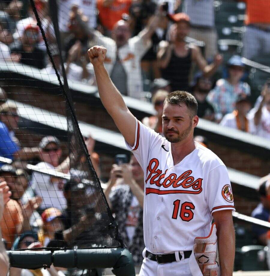 Baltimore Orioles designated hitter Trey Mancini (16) acknowledges the crowd during the ninth inning of a baseball game against the Tampa Bay Rays, Thursday, July 28, 2022, in Baltimore. (AP Photo/Terrance Williams)