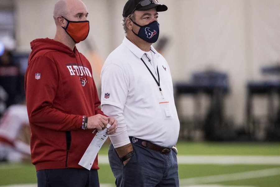 Houston Texans executive vice president, football operations Jack Easterby, left, stands with Texans chairman and CEO Cal McNair as they watch workouts during an NFL training camp football practice Friday, Aug. 14, 2020, at The Houston Methodist Training Center in Houston. (Brett Coomer/Houston Chronicle via AP)