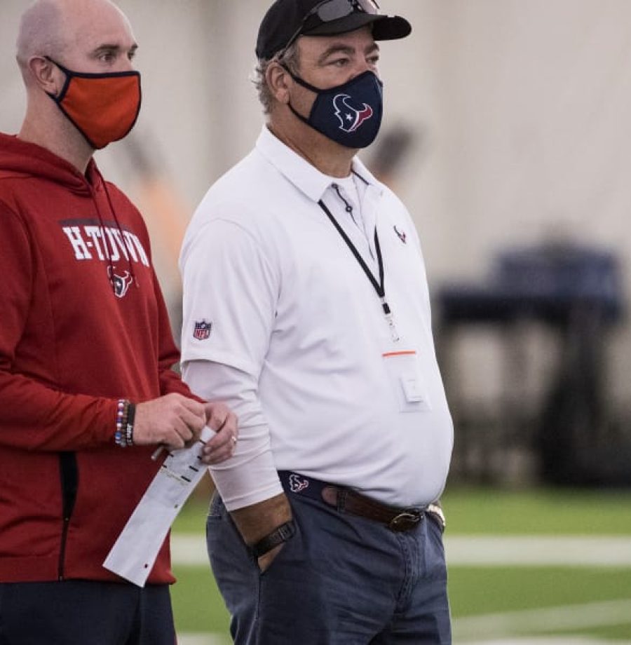 Houston Texans executive vice president, football operations Jack Easterby, left, stands with Texans chairman and CEO Cal McNair as they watch workouts during an NFL training camp football practice Friday, Aug. 14, 2020, at The Houston Methodist Training Center in Houston. (Brett Coomer/Houston Chronicle via AP)