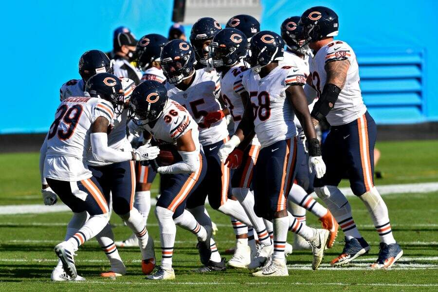 CHARLOTTE, NORTH CAROLINA - OCTOBER 18: DeAndre Houston-Carson #36 of the Chicago Bears celebrates with teammates after making an interception in the fourth quarter at Bank of America Stadium on October 18, 2020 in Charlotte, North Carolina. (Photo by Grant Halverson/Getty Images)