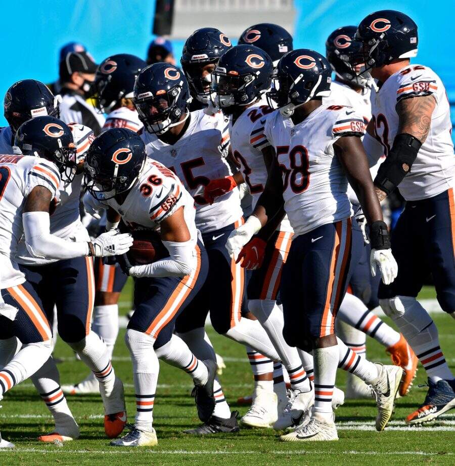 CHARLOTTE, NORTH CAROLINA - OCTOBER 18: DeAndre Houston-Carson #36 of the Chicago Bears celebrates with teammates after making an interception in the fourth quarter at Bank of America Stadium on October 18, 2020 in Charlotte, North Carolina. (Photo by Grant Halverson/Getty Images)