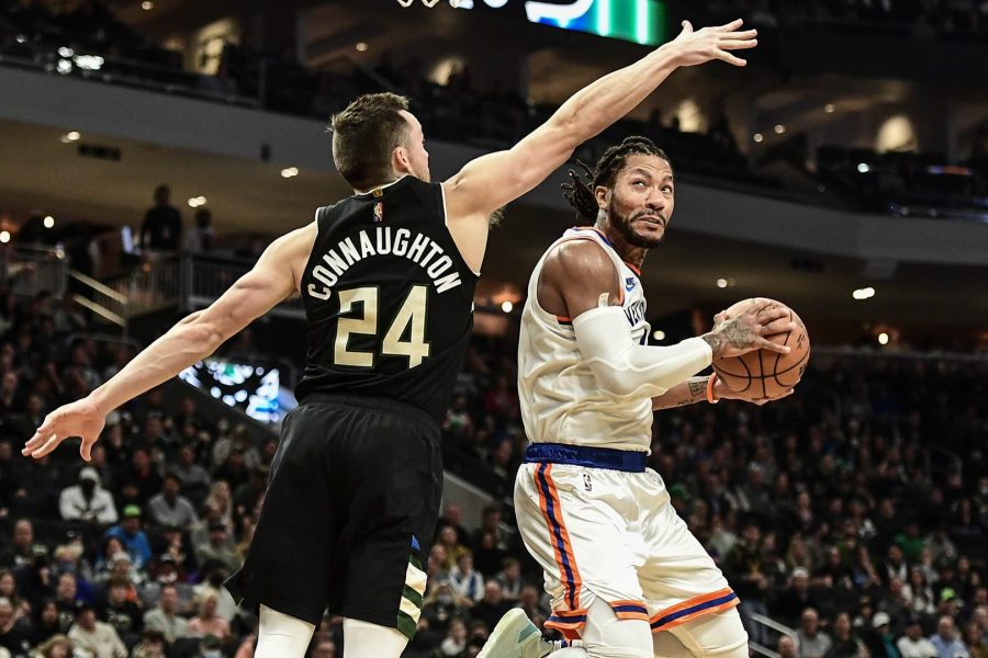 Nov 5, 2021; Milwaukee, Wisconsin, USA; New York Knicks guard Derrick Rose (4) takes a shot against Milwaukee Bucks guard Pat Connaughton (24) in the second quarter at Fiserv Forum. Mandatory Credit: Benny Sieu-USA TODAY Sports