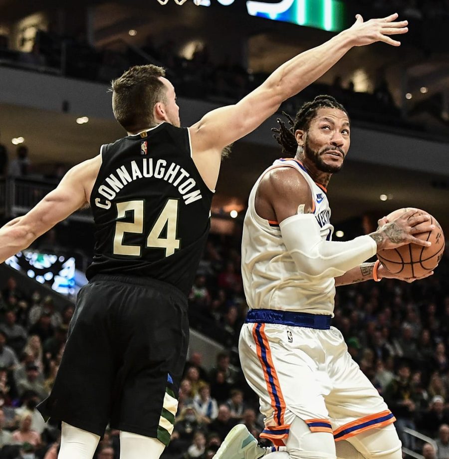 Nov 5, 2021; Milwaukee, Wisconsin, USA; New York Knicks guard Derrick Rose (4) takes a shot against Milwaukee Bucks guard Pat Connaughton (24) in the second quarter at Fiserv Forum. Mandatory Credit: Benny Sieu-USA TODAY Sports