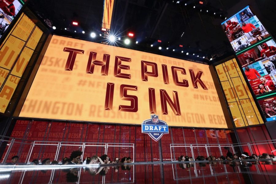ARLINGTON, TX - APRIL 26:  A video board displays the text "THE PICK IS IN" for the Washington Redskins during the first round of the 2018 NFL Draft at AT&T Stadium on April 26, 2018 in Arlington, Texas.  (Photo by Ronald Martinez/Getty Images)