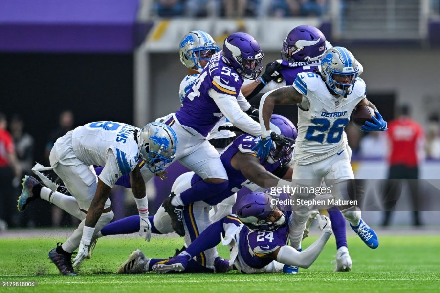 MINNEAPOLIS, MINNESOTA - OCTOBER 20: Jahmyr Gibbs #26 of the Detroit Lions is tackled by Camryn Bynum #24 of the Minnesota Vikings in the second quarter of a game at U.S. Bank Stadium on October 20, 2024 in Minneapolis, Minnesota. (Photo by Stephen Maturen/Getty Images)