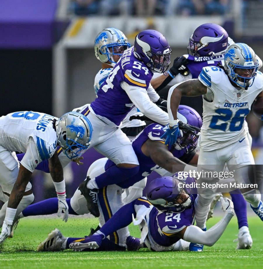 MINNEAPOLIS, MINNESOTA - OCTOBER 20: Jahmyr Gibbs #26 of the Detroit Lions is tackled by Camryn Bynum #24 of the Minnesota Vikings in the second quarter of a game at U.S. Bank Stadium on October 20, 2024 in Minneapolis, Minnesota. (Photo by Stephen Maturen/Getty Images)