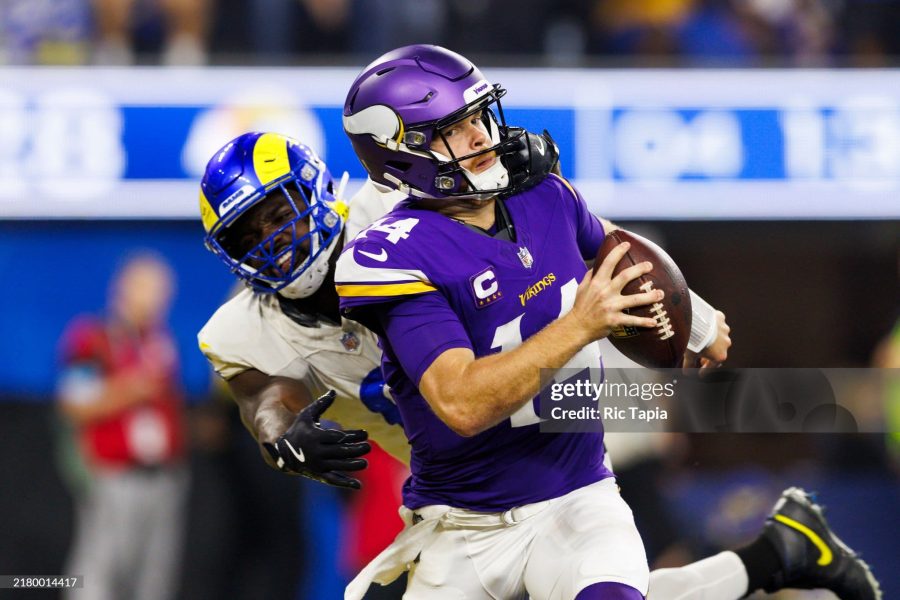 INGLEWOOD, CALIFORNIA - OCTOBER 24: Jared Verse (L) #8 of the Los Angeles Rams sacks Sam Darnold #14 of the Minnesota Vikings for a safety during the second half at SoFi Stadium on October 24, 2024 in Inglewood, California. (Photo by Ric Tapia/Getty Images)