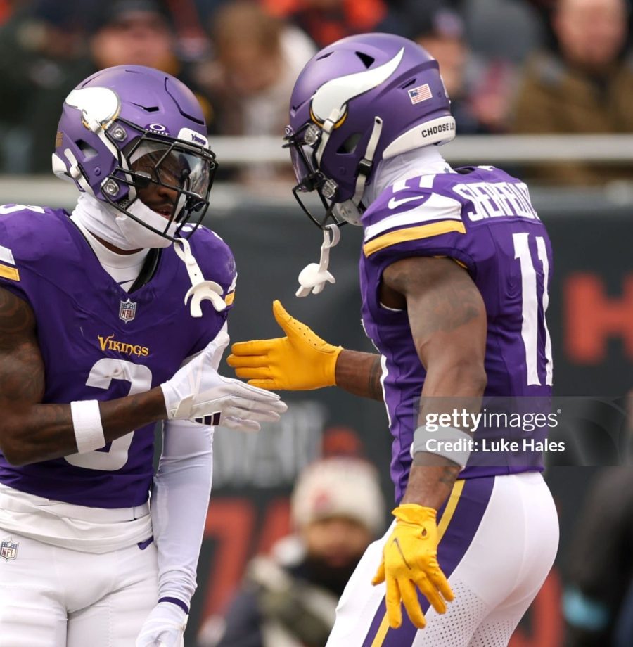 CHICAGO, ILLINOIS - NOVEMBER 24: Jordan Addison #3 and Trent Sherfield Sr. #11 of the Minnesota Vikings celebrate after a touchdown during the second quarter against the Chicago Bears at Soldier Field on November 24, 2024 in Chicago, Illinois. (Photo by Luke Hales/Getty Images)