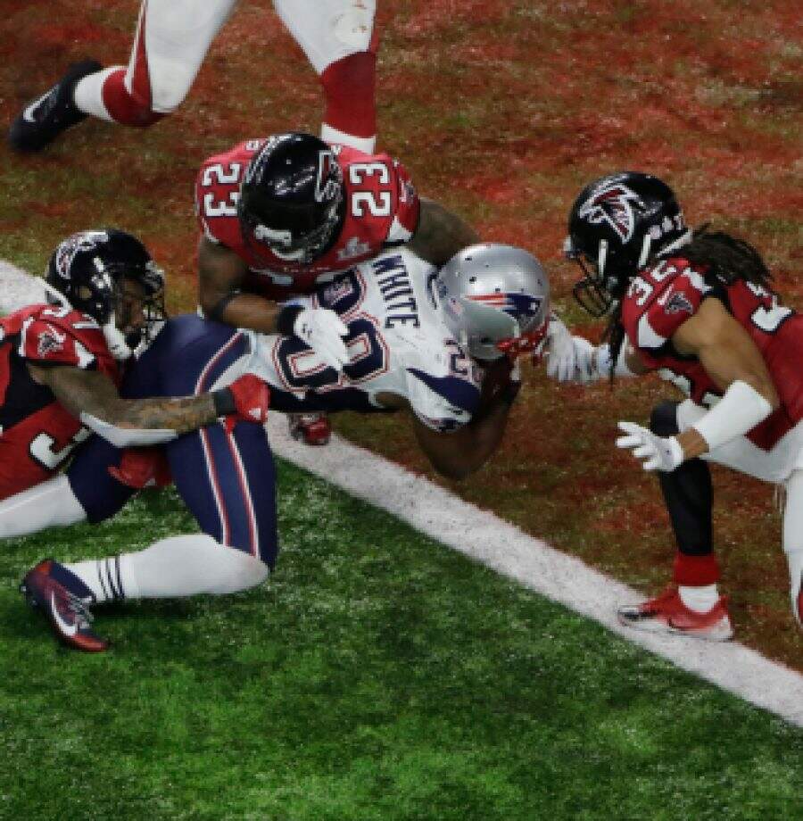 New England Patriots' James White scores the winning touchdown during overtime of the NFL Super Bowl 51 football game against the Atlanta Falcons, Sunday, Feb. 5, 2017, in Houston. (AP Photo/Charlie Riedel)