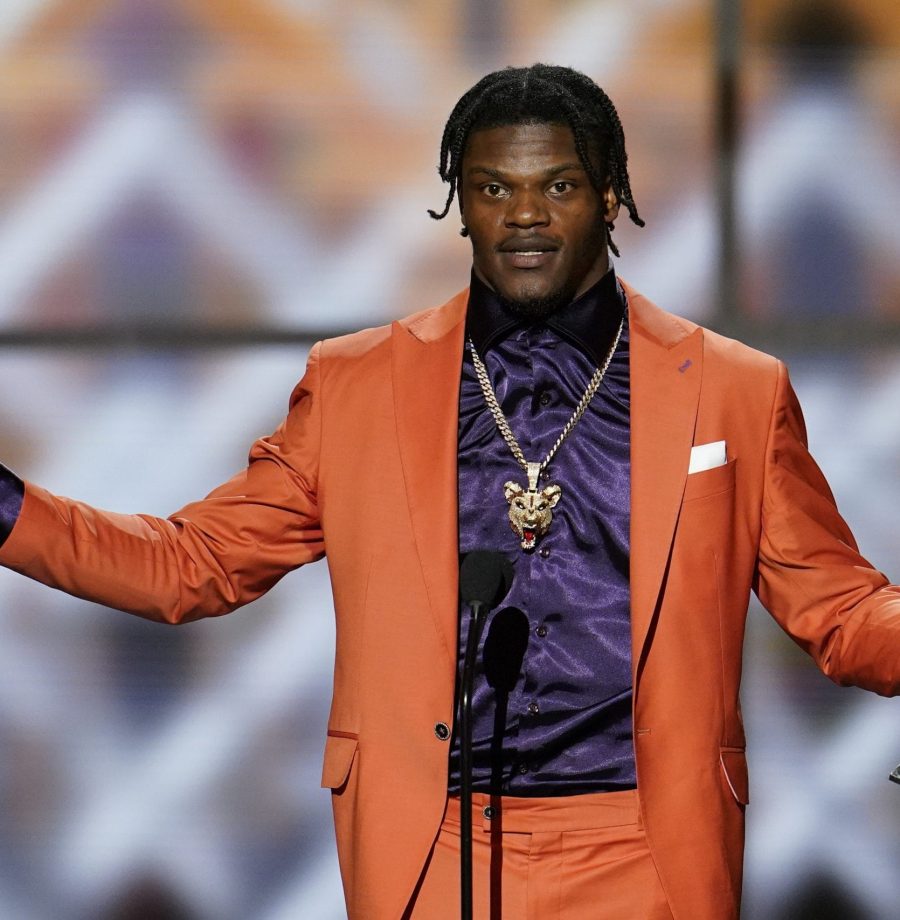Baltimore Ravens' Lamar Jackson speaks after winning the AP Most Valuable Player award at the NFL Honors football award show Saturday, Feb. 1, 2020, in Miami. (AP Photo/David J. Phillip)