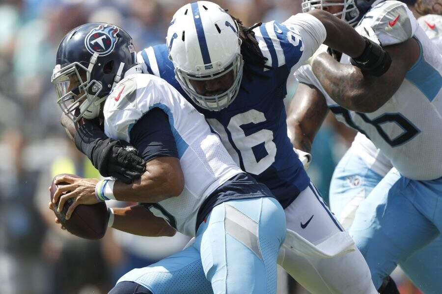Tennessee Titans quarterback Marcus Mariota is sacked by Indianapolis Colts defensive tackle Denico Autry (96) for a 13-yard loss in the first half of an NFL football game Sunday, Sept. 15, 2019, in Nashville, Tenn. (AP Photo/Wade Payne)