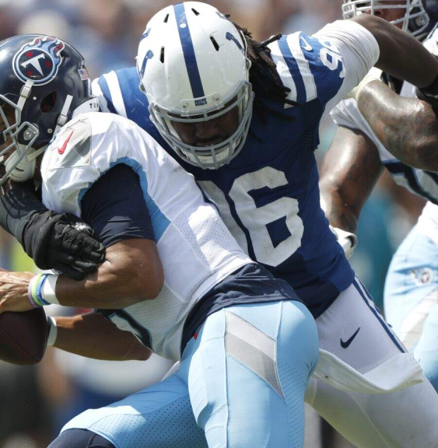 Tennessee Titans quarterback Marcus Mariota is sacked by Indianapolis Colts defensive tackle Denico Autry (96) for a 13-yard loss in the first half of an NFL football game Sunday, Sept. 15, 2019, in Nashville, Tenn. (AP Photo/Wade Payne)
