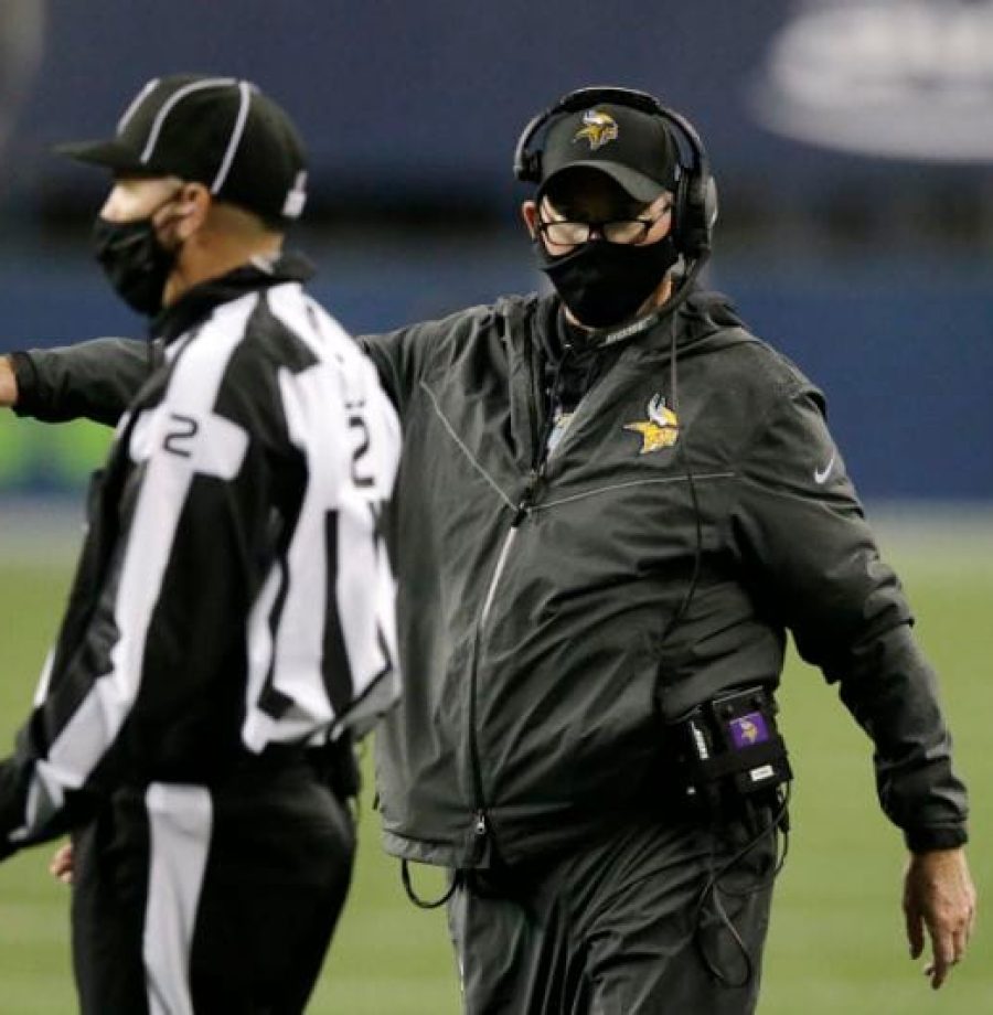Minnesota Vikings head coach Mike Zimmer talks with an official during the second half of an NFL football game against the Seattle Seahawks, Sunday, Oct. 11, 2020, in Seattle. (AP Photo/John Froschauer)