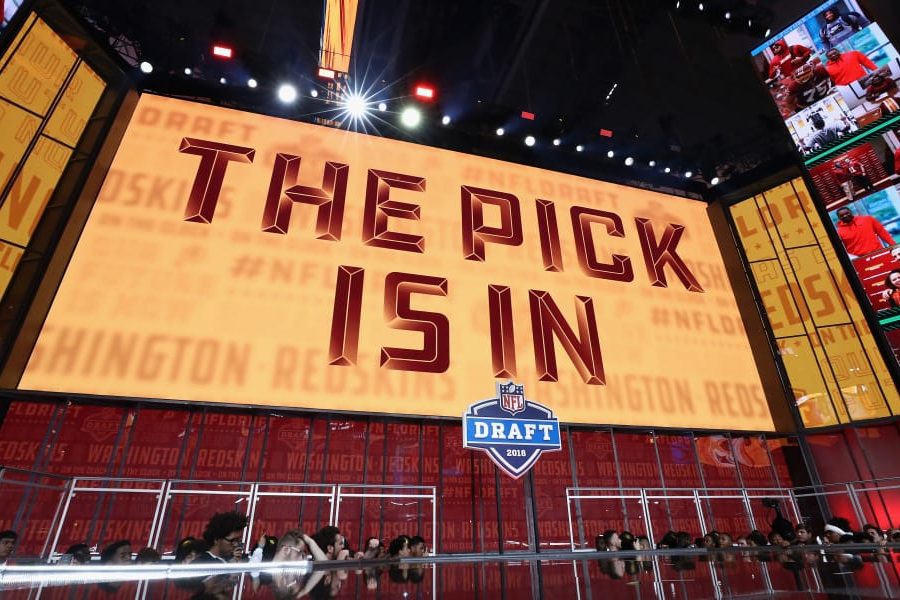 ARLINGTON, TX - APRIL 26:  A video board displays the text "THE PICK IS IN" for the Washington Redskins during the first round of the 2018 NFL Draft at AT&T Stadium on April 26, 2018 in Arlington, Texas.  (Photo by Ronald Martinez/Getty Images)