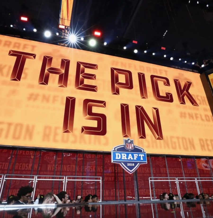 ARLINGTON, TX - APRIL 26:  A video board displays the text "THE PICK IS IN" for the Washington Redskins during the first round of the 2018 NFL Draft at AT&T Stadium on April 26, 2018 in Arlington, Texas.  (Photo by Ronald Martinez/Getty Images)
