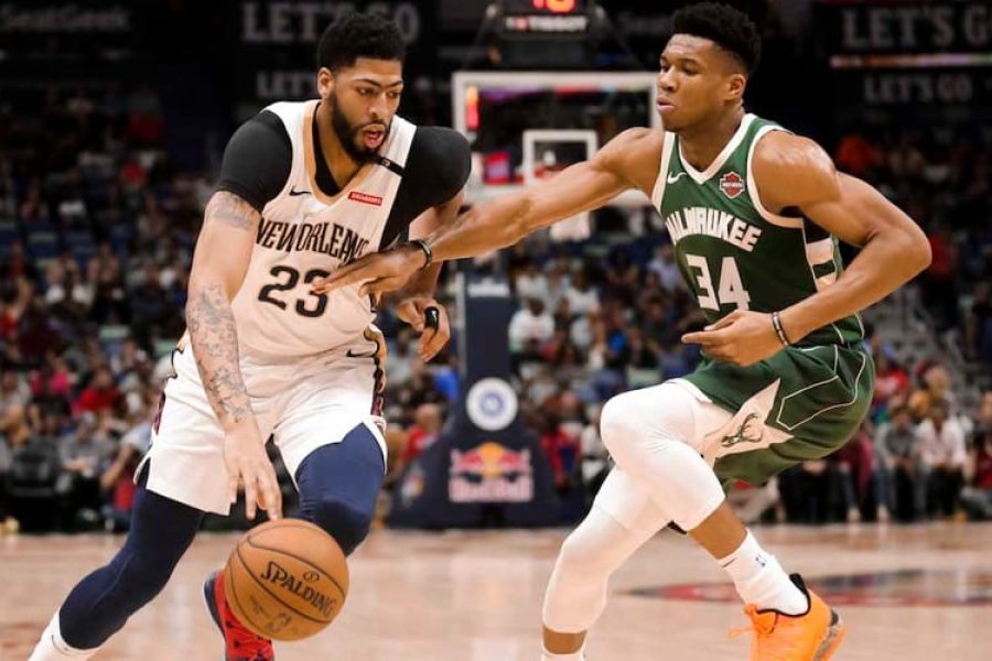Mar 12, 2019; New Orleans, LA, USA; New Orleans Pelicans forward Anthony Davis (23) drives past Milwaukee Bucks forward Giannis Antetokounmpo (34) during the first quarter at the Smoothie King Center. Mandatory Credit: Derick E. Hingle-USA TODAY Sports - 12334062