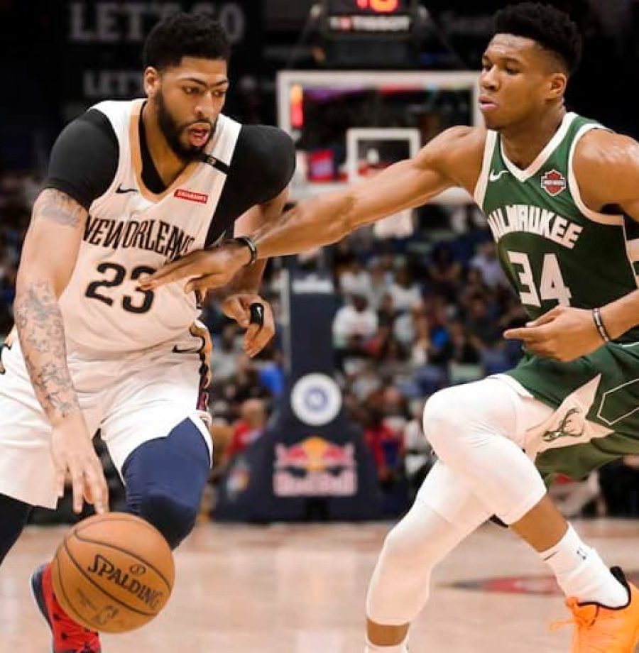 Mar 12, 2019; New Orleans, LA, USA; New Orleans Pelicans forward Anthony Davis (23) drives past Milwaukee Bucks forward Giannis Antetokounmpo (34) during the first quarter at the Smoothie King Center. Mandatory Credit: Derick E. Hingle-USA TODAY Sports - 12334062