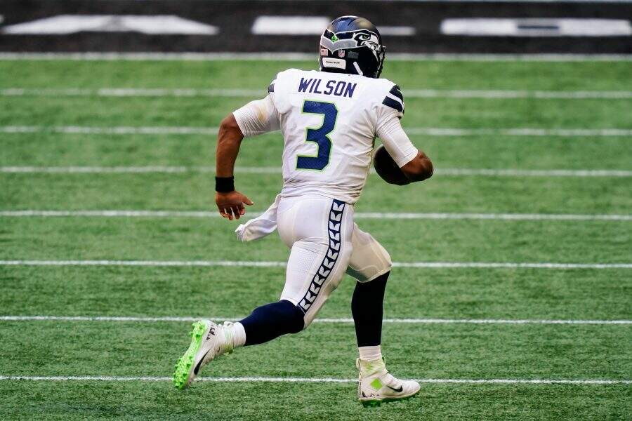 Seattle Seahawks quarterback Russell Wilson (3) runs in the open field against the Atlanta Falcons during the second half of an NFL football game, Sunday, Sept. 13, 2020, in Atlanta. (AP Photo/Brynn Anderson)